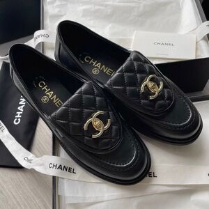 CHANEL Black Quilted Loafers with Gold Accent
